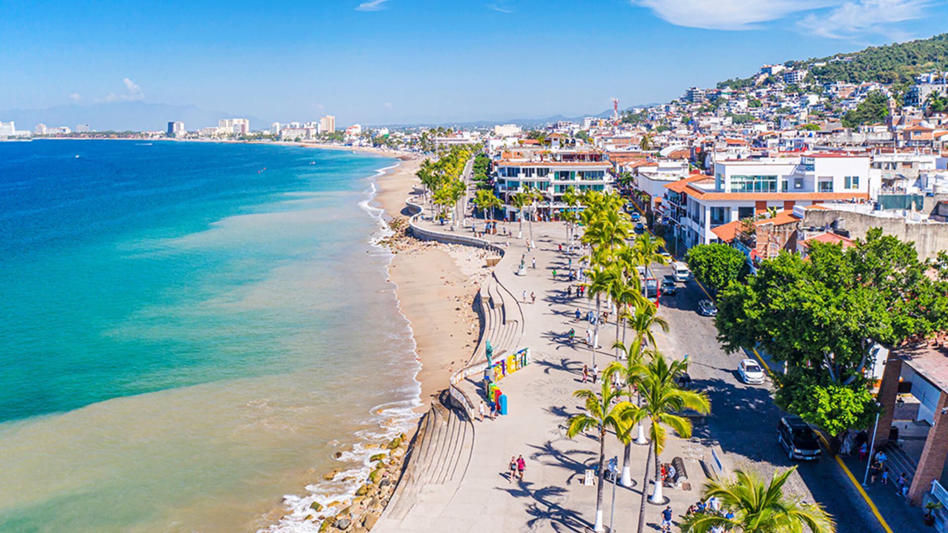 Aerial view of Puerto Vallarta coastline with city buildings and blue ocean